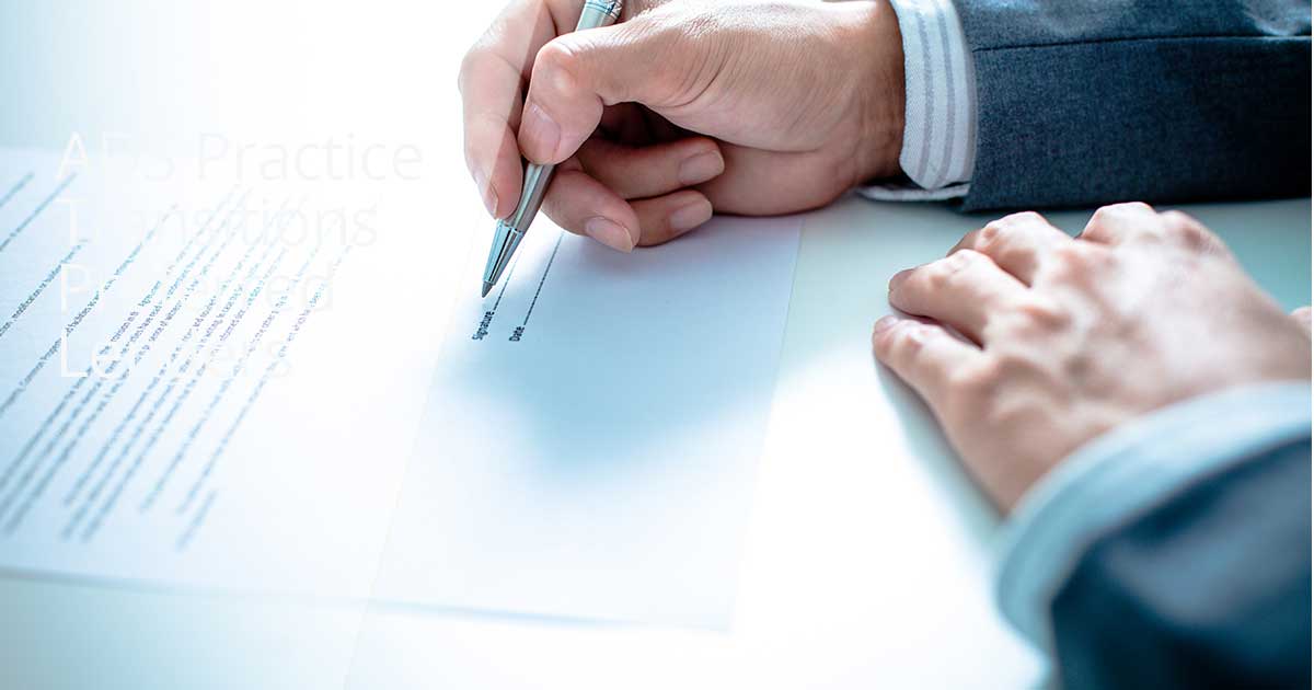 Person signing a document.